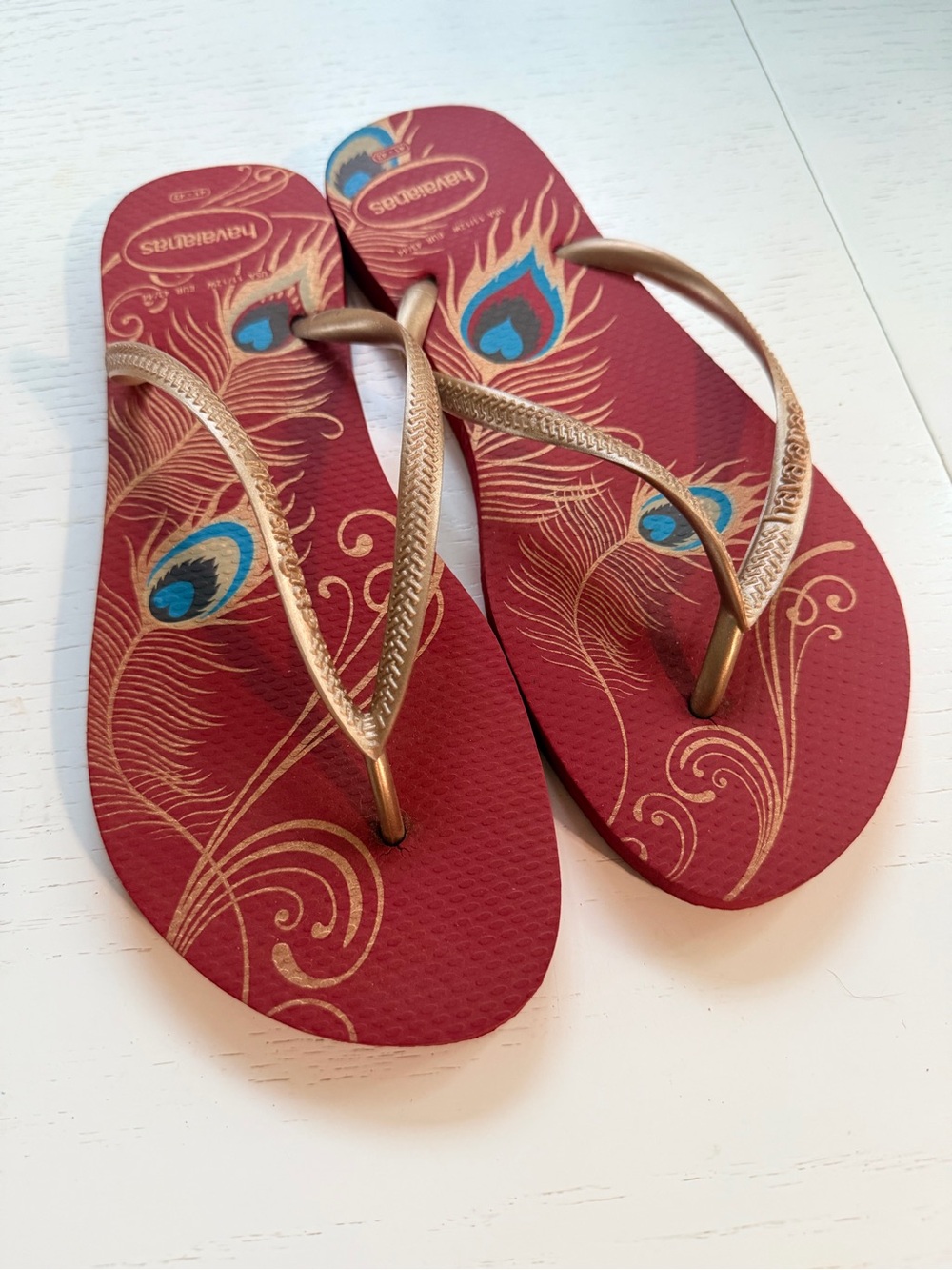 Havaianas Women's Red Flip Flops with thin Metallic Gold Straps, peacock design - Picture 2 of 5